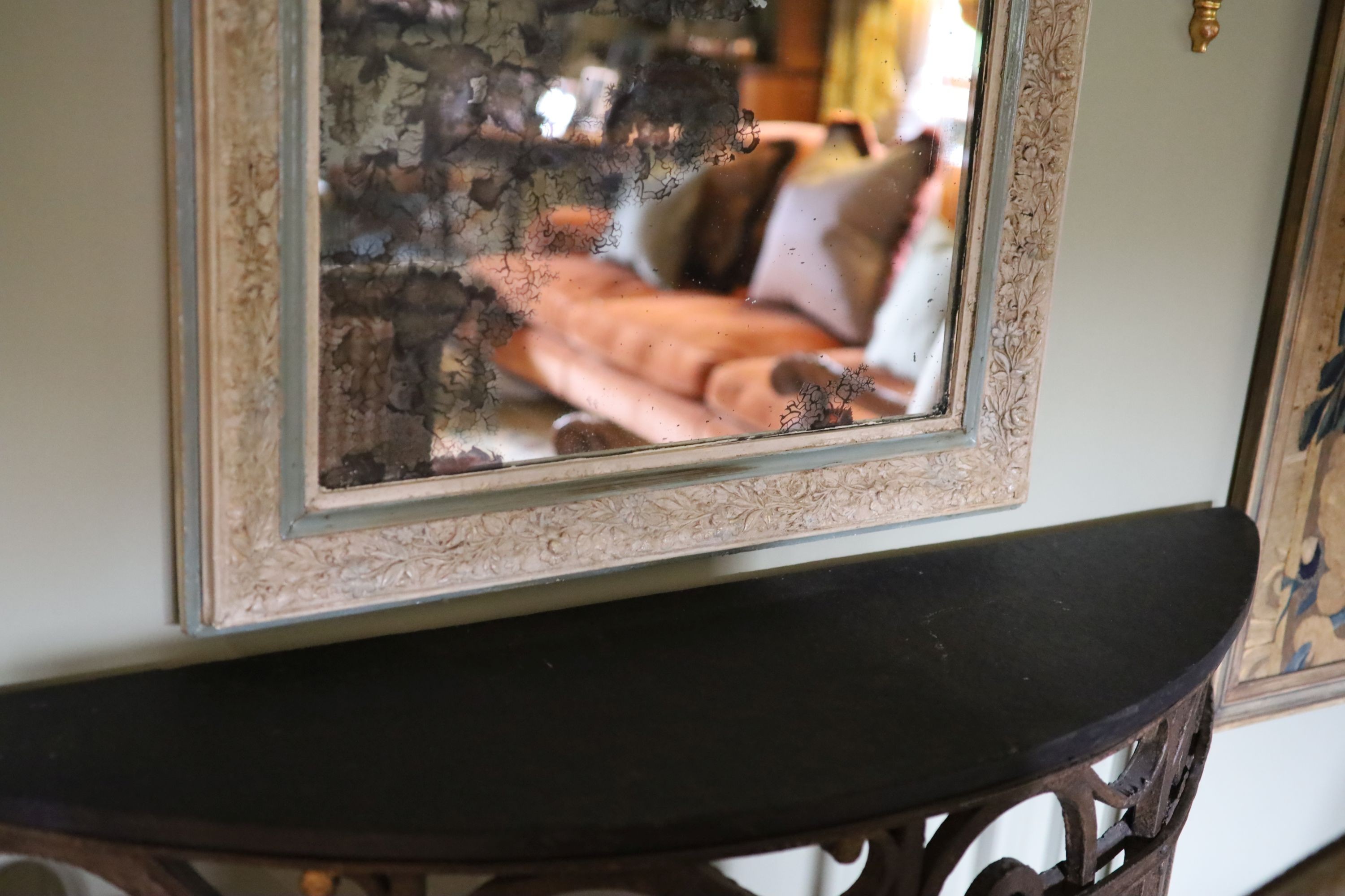 A late 19th century French blue and white painted gesso wall mirror, with laurel and floral basket frieze over a rectangular plate, width 76cm height 134cm